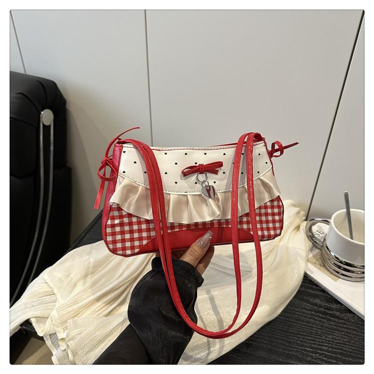 Японская милая сумка-багет с бантом под мышкой женская 2025 новая нишевая высококлассная девичья портативная сумка через плечо