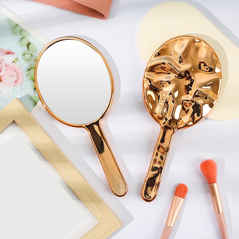 

Liquid-Finish Ellipsoid Mirror – Portable Handheld Makeup Mirror for Travel and Desktop Use рожевий колір золота