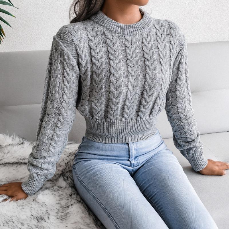 Autumn and winter new solid color twist knitted long-sleeved round neck pullover waist sexy spice sweater women