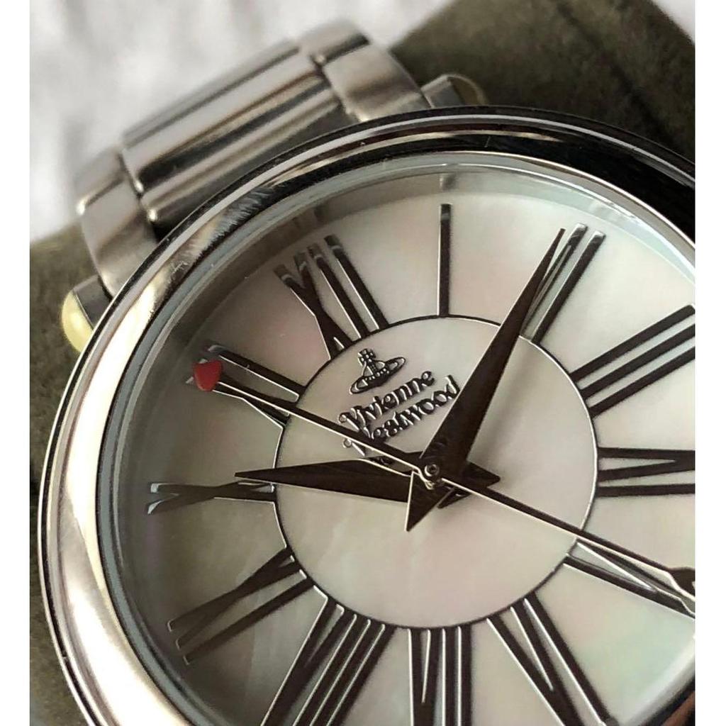 Used Vivienne Westwood watch with shell dial and Orb chaRM