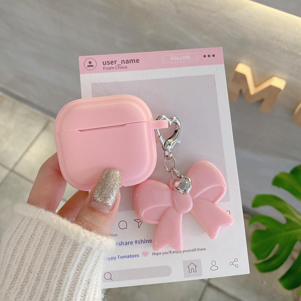 Schutzhülle aus weichem Silikon mit Schleifenanhänger für AirPods 1, 2, 3 und 4 sowie Apple AirPods Pro 2 – ein ideales Geschenk für Frauen und Mädchen.