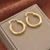 Retro Light Luxury Embossed Hoop Earrings: Gold-Plated Alloy C-Shaped Earrings for Women with a Cool, Niche Design