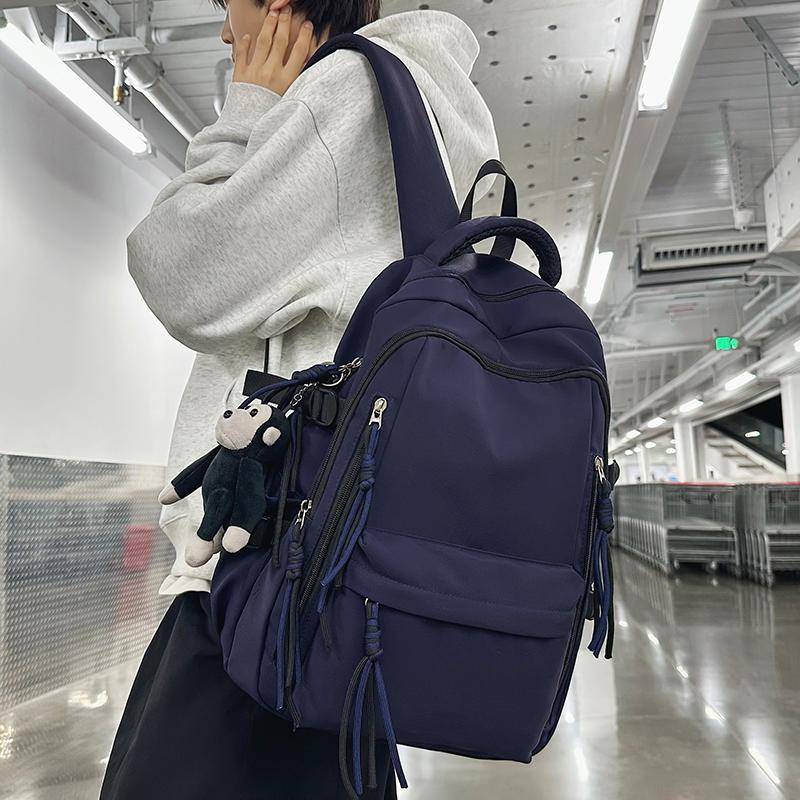 Ryggsäck för män i enfärgat utförande Ryggsäck för kvinnor med flera fickor Stor kapacitet Student Skolväska