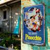 A Beautifully Designed Tin Sign Featuring Authorized Classic Cartoon Characters Pinocchio And Geppetto, Officially Licensed for
