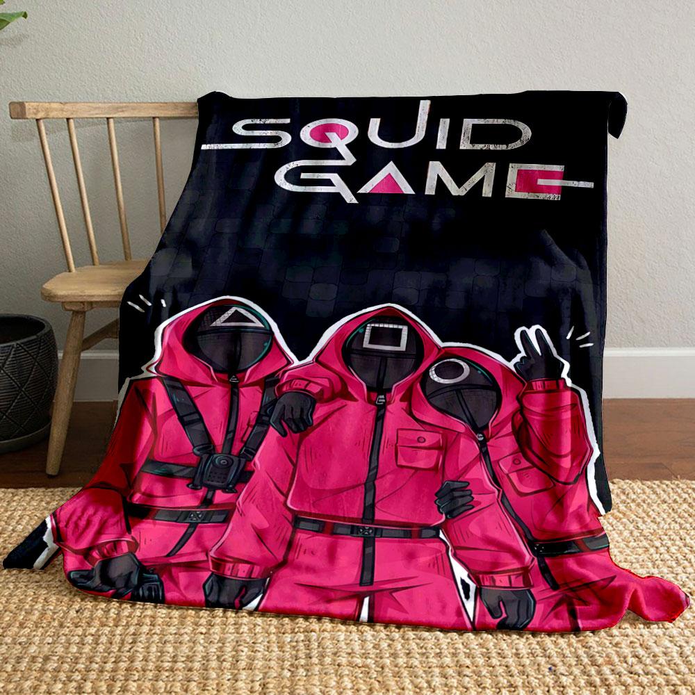 Red hooded figures with geometric masks on a dark tiled background. for all seasons blanket lunch break throw gift