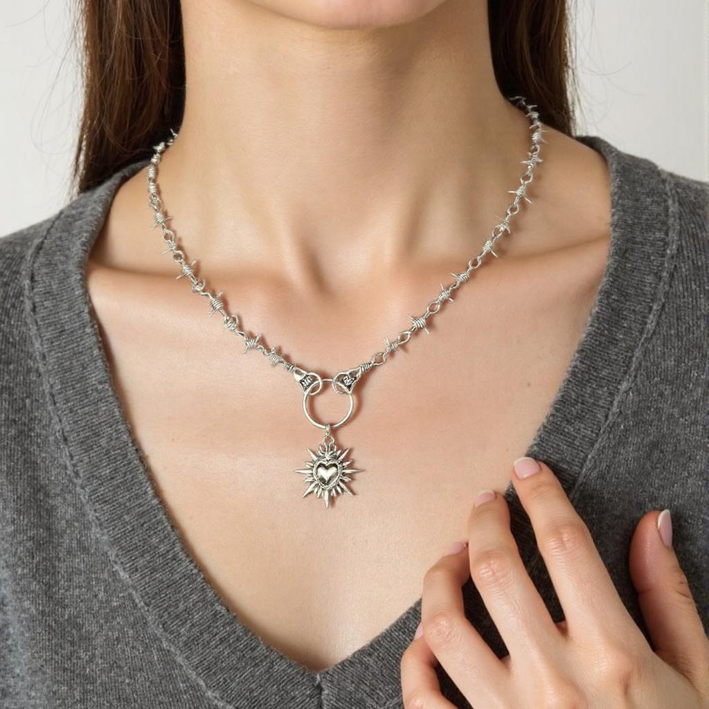 Unique Heart In Hand Barbed Wire Necklace Accessory Symbolizing Resilience and Tenderness for Fashion Enthusiasts