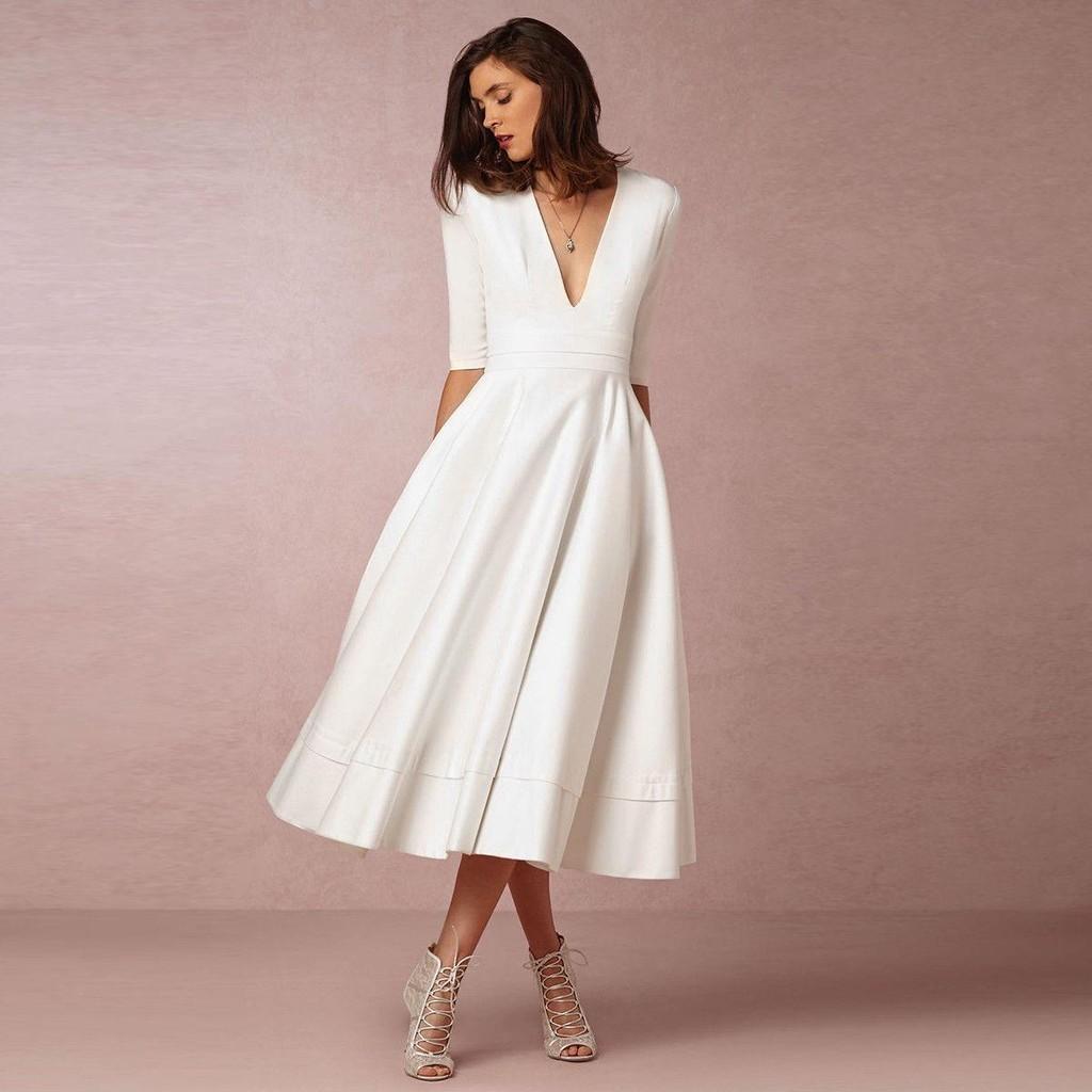 Robe élégante et décontractée en maille pour femme, avec col en V, disponible en plusieurs couleurs.