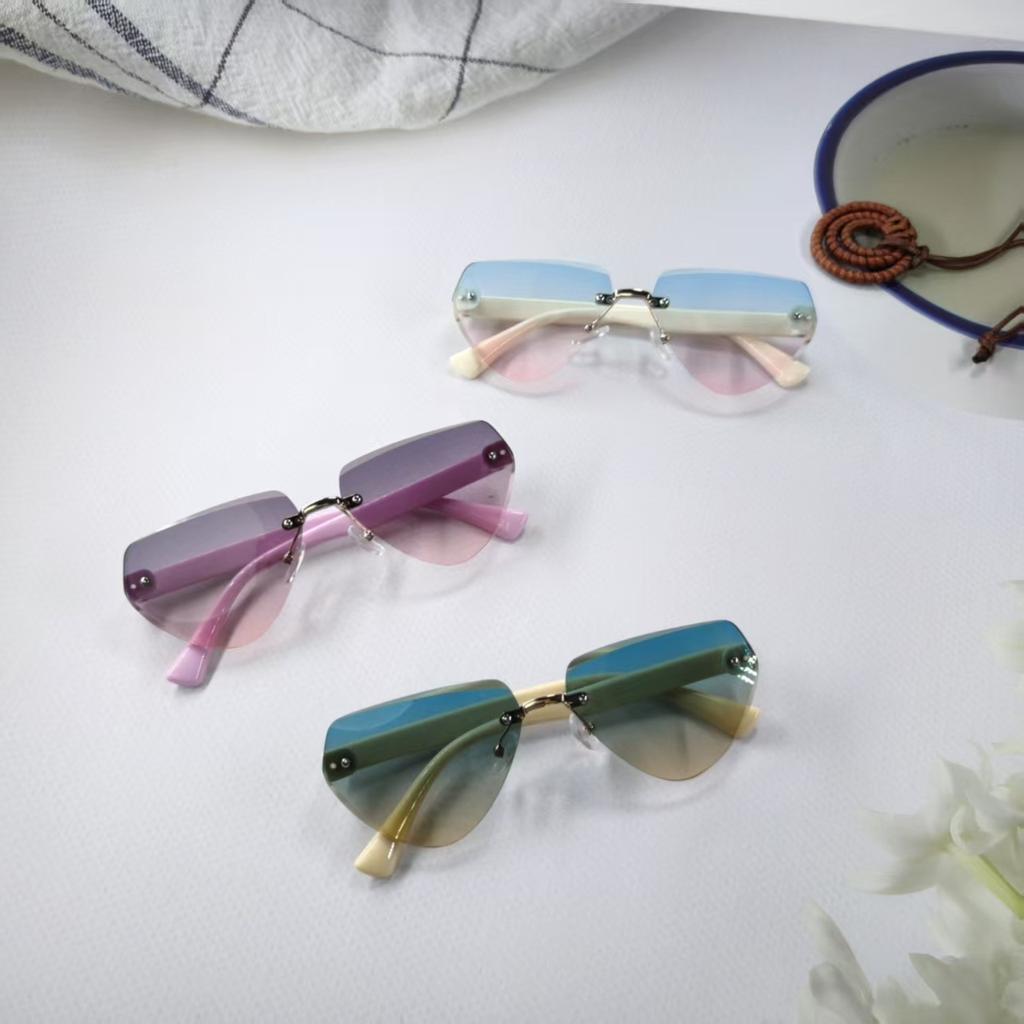 New Children's Sunglasses Fashion Frameless Irregular Personality Trend Dopamine Color Ocean Lens Cross 26016