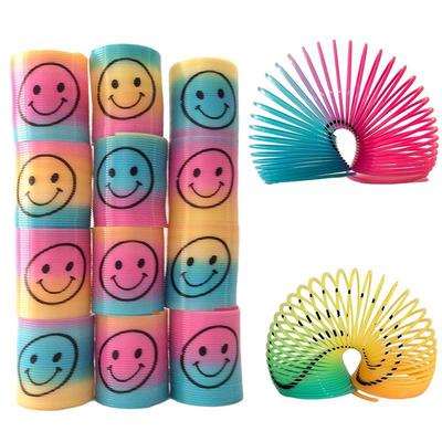 12x Mini Slinky Smiley Face Springs Rainbow Smiley Face Spring Party Bag Fillers Plastic