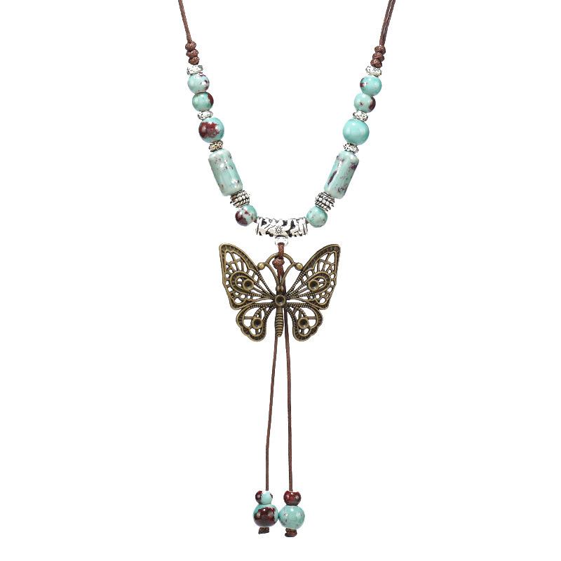 Retro literary and artistic ceramic butterfly necklace female long fringed sweater chain with jewelry collarbone chain