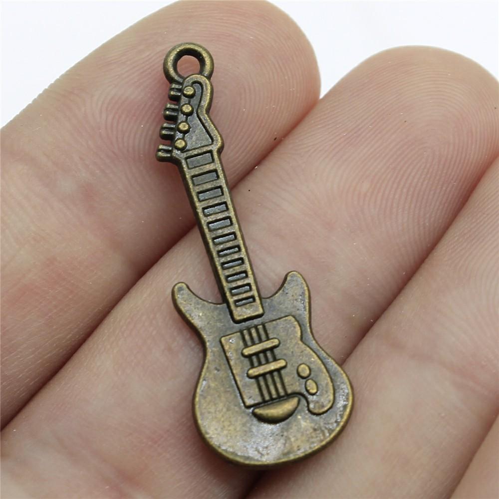 10 sztuk zawieszek muzycznych Instrumenty muzyczne Gitara Bęben Fortepian Mikrofon Zawieszki do tworzenia biżuterii