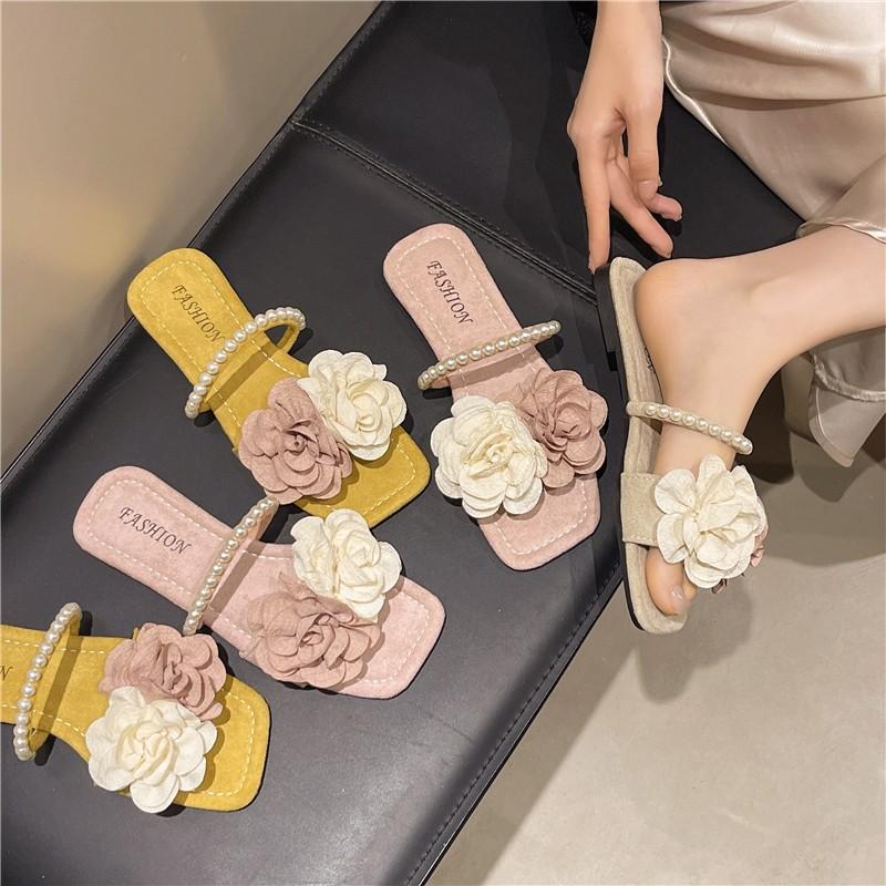 Neue Pantoffeln Damenmode vielseitig flacher Boden Ein-Wort-Schlepper Sommer weicher Boden Oberbekleidung Temperament Blume coole Pantoffeln Damen