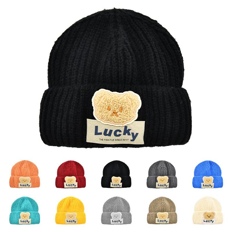 

Autumn and winter new children s cartoon bear patch solid color crimped knitted hat boys and girls foreign versatile wool cold hat average size (56-58CM) чорний