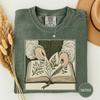 Hands Turning an Open Herbal Tshirt, Engraved Witch Art, Vintage Herbal Shirt, Dark Academia Tee, Spooky Season Gift, Witchy Graphic