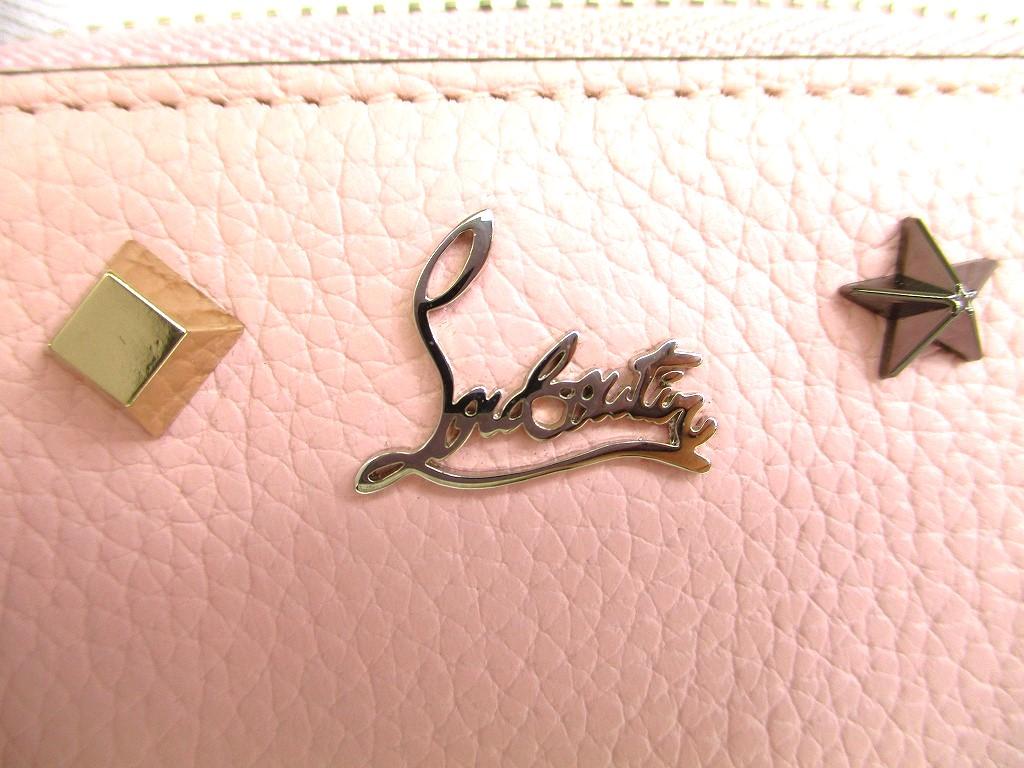 Porte-monnaie rond zippé en cuir rose clair Christian Louboutin authentique #9691 remis à neuf