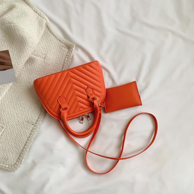 

2025 new spring candy color foreign style trendy hand shell bag women s simple casual fashion shoulder messenger bag помаранчевий