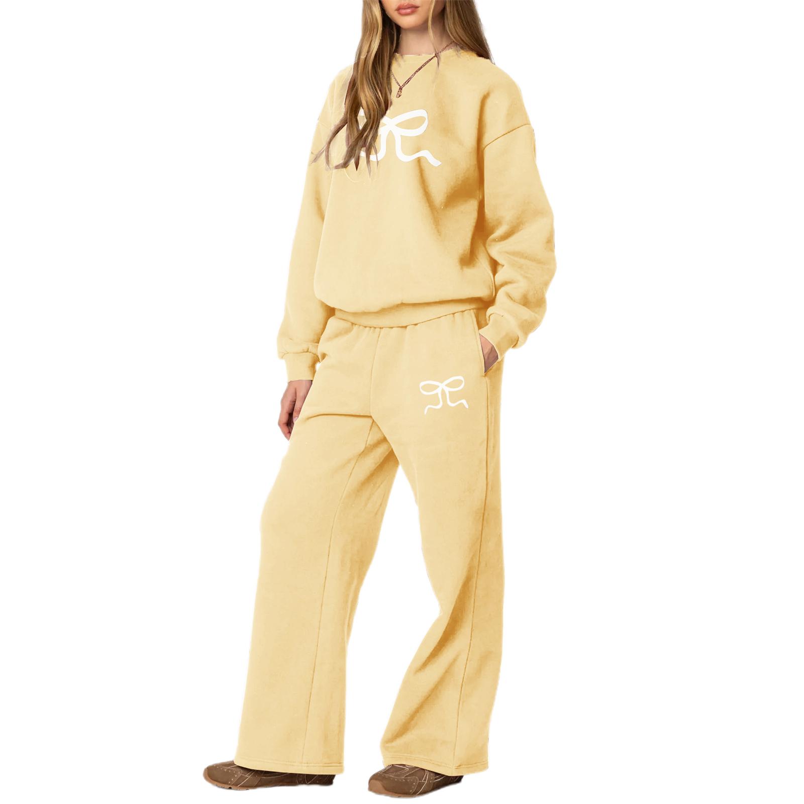 

Жіночий костюм зі штанів, худі з довгим рукавом і круглим вирізом з принтом бантиків та спортивні штани, комплект для активного відпочинку S жовтий