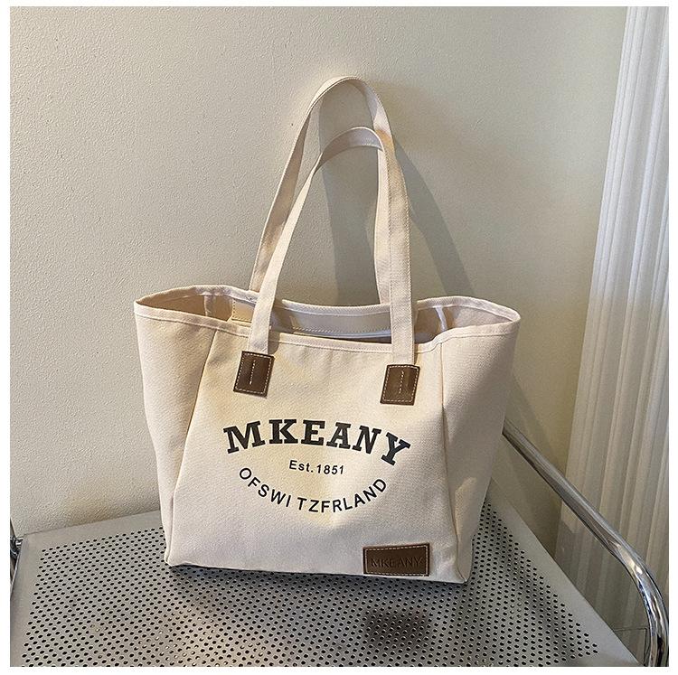 

Новая холщовая сумка большой вместимости женская 2025 осенняя мода сумка-тоут с принтом букв повседневная простая сумка белый