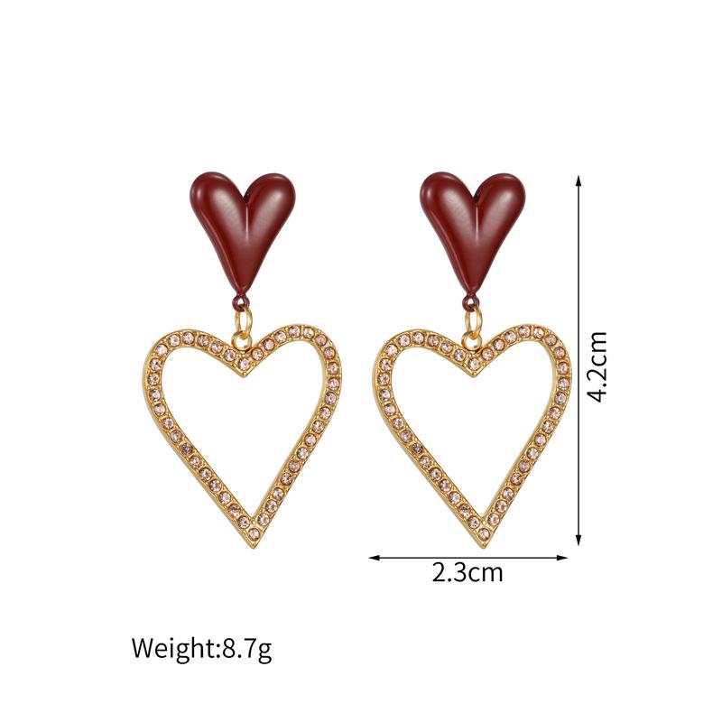 

18k Gold Hollow Heart Stainless Steel Earrings: Light Luxury, Niche Design for Autumn/Winter.