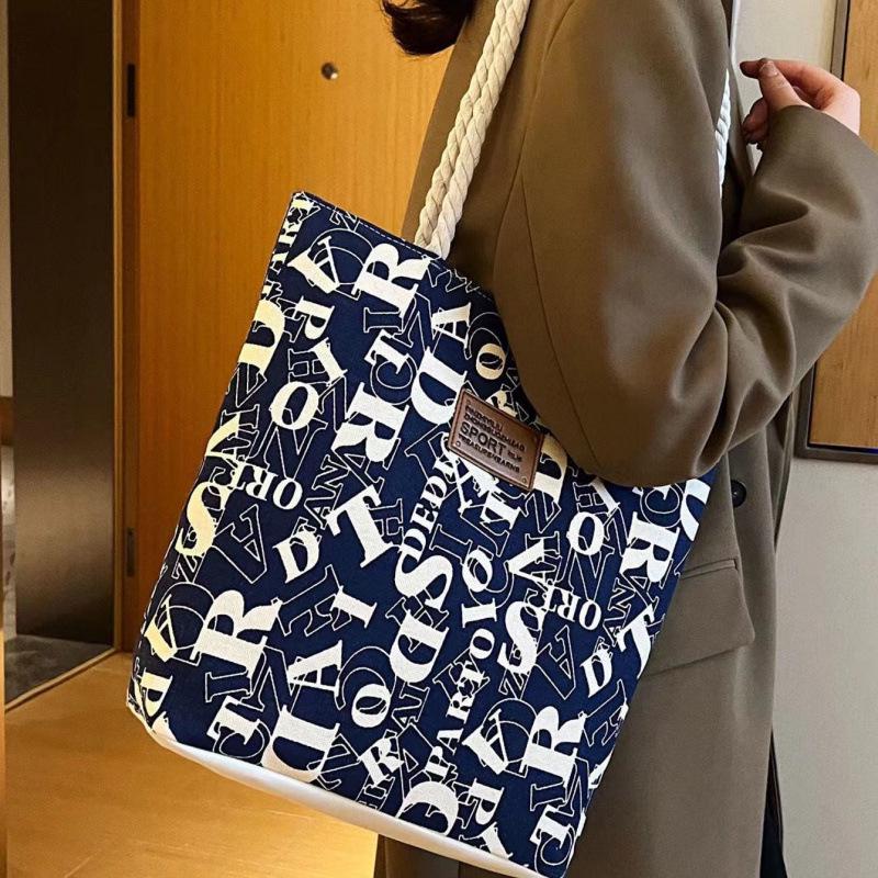 Large Capacity Canvas Tote: Simple, Stylish Commuter Bag for Female Students with Letter Print