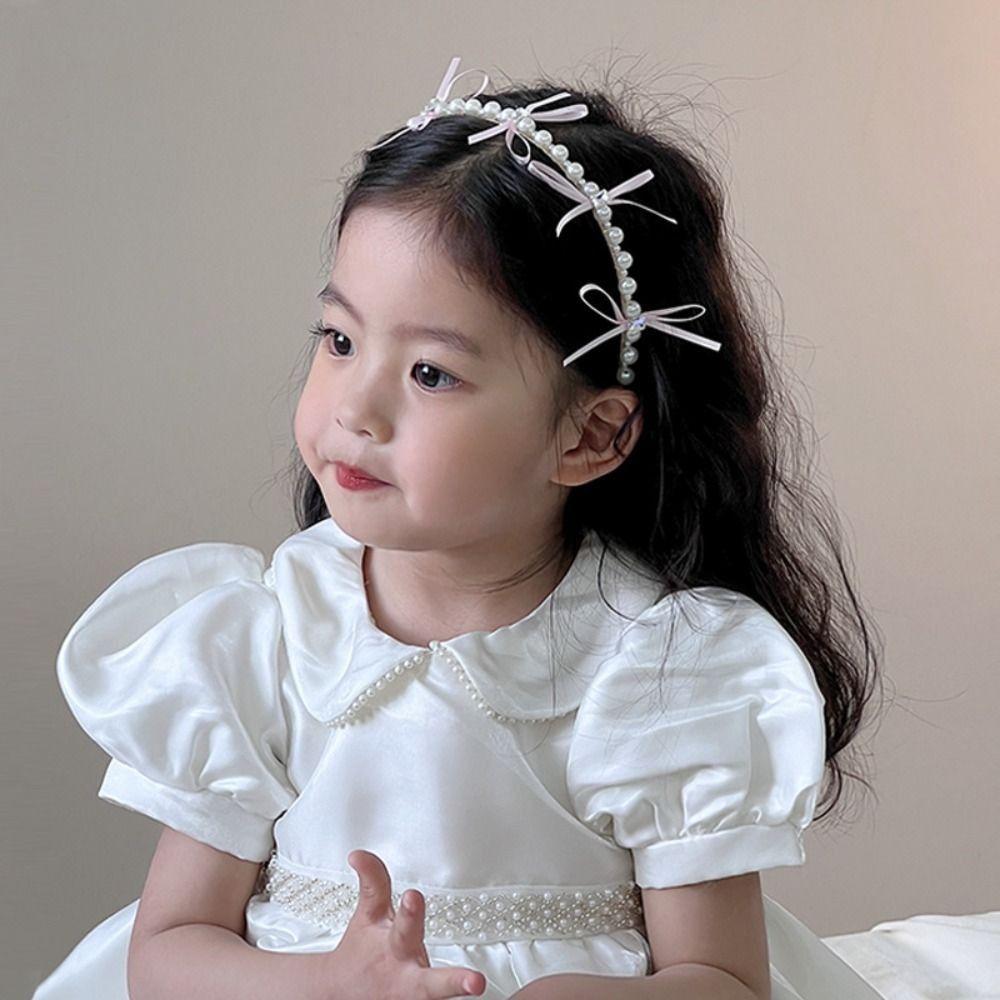 Bílý princeznovský vlasový obruč Roztomilá dětská čelenka Elegantní perlová mašle Vlasové pásky pro děti