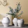 Minimalist White Ceramic Flower Vase for Fresh Flowers and Green Plants In Living Room or Model Room Decor.