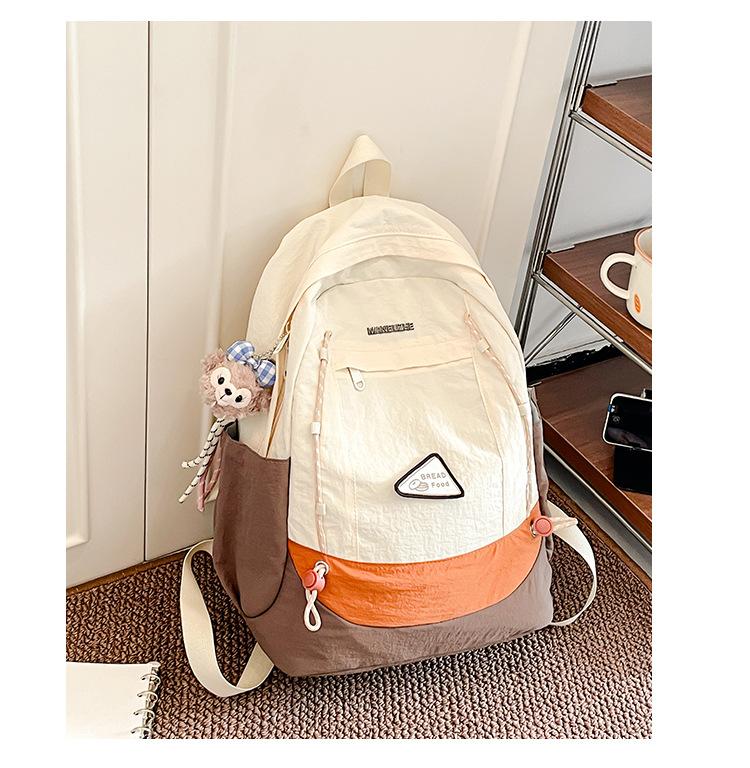 Simple schoolbag, Korean contrasting colors, new schoolbag, light travel and leisure backpack, high value, dirt-resistant