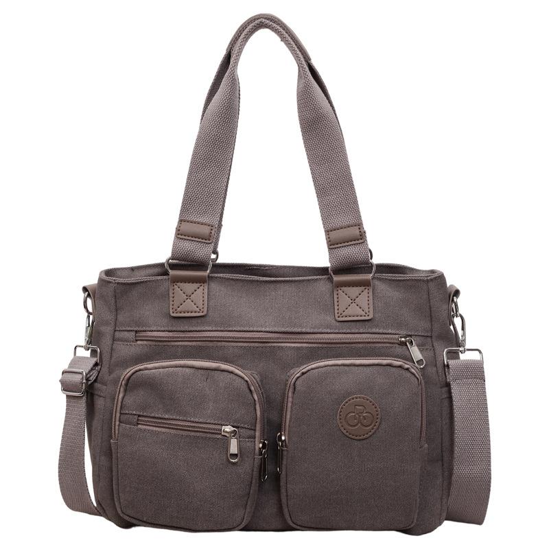 

Stylish Canvas Shoulder Bag for Women, Multi-Pocket Tote with Adjustable Strap and Durable Design сірий колір