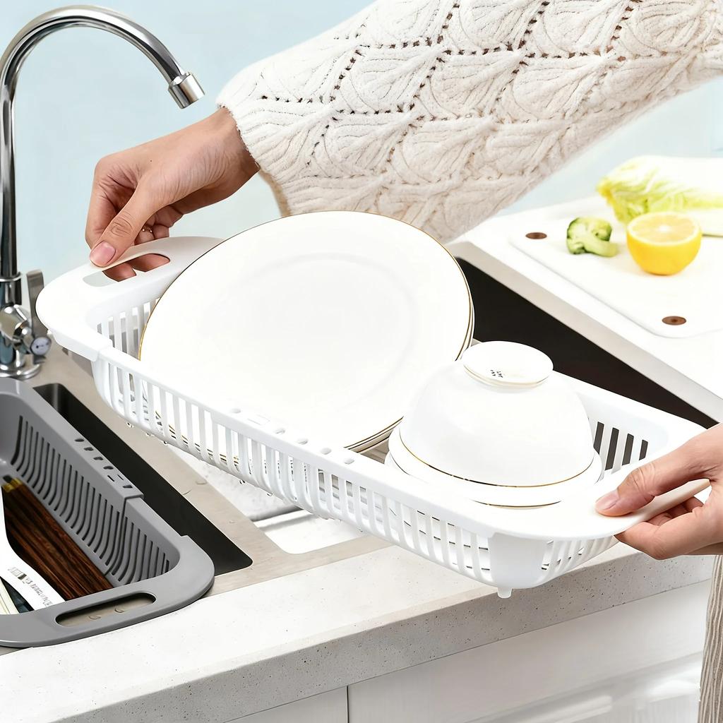 Rozkládací dřezový cedník - Nastavitelná výška, nerezavějící a prostorově úsporný pro snadné odvodnění a mytí.