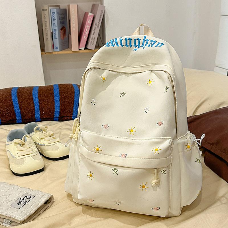 Design sense dopamine embroidery large capacity junior high school bag ins niche female high school student lightweight backpack