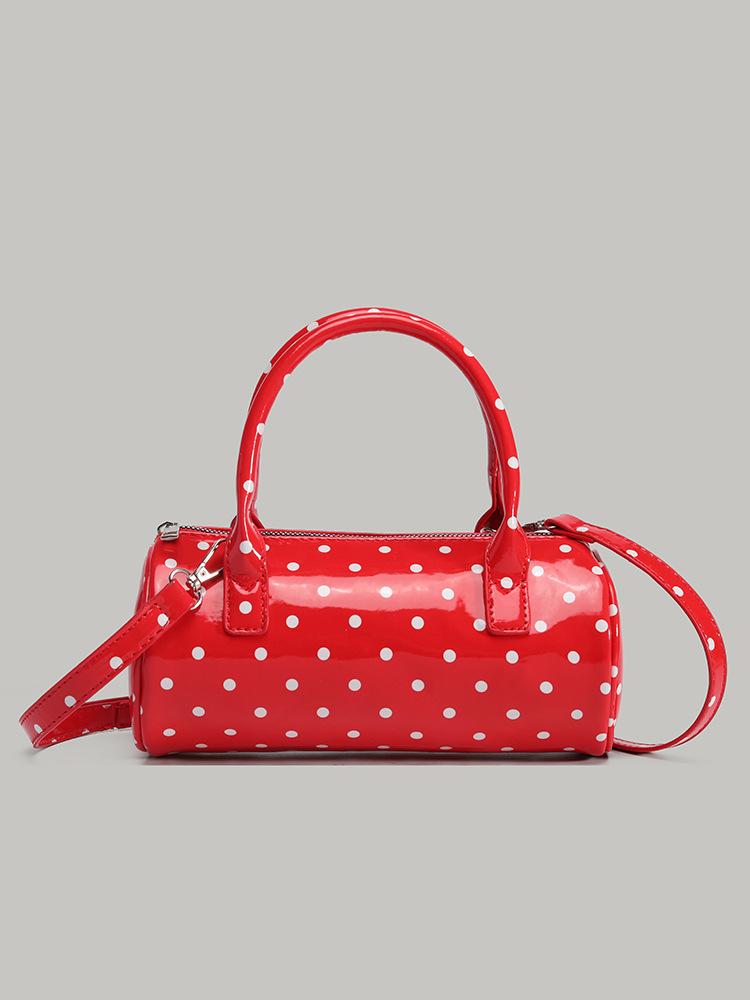 

Korean cute polka dot portable cylinder bag female niche design Spice girl hand bag commuter shoulder messenger bag