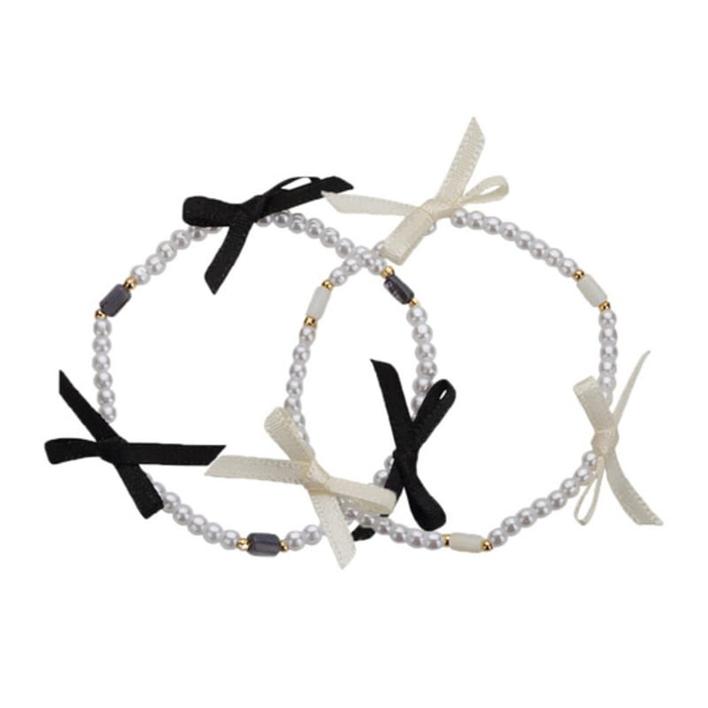 Charmy triple black ribbon pearl-bracelet