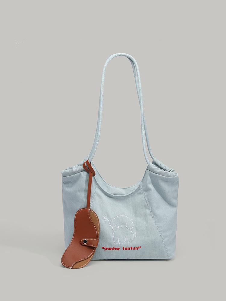 

Niche embroidered puppy shoulder bag female Korean simple retro denim canvas bag commuter large capacity tote bag синий