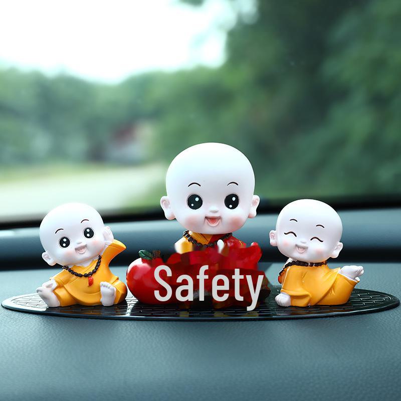 Creative Little Monk Maitreya Buddha Car Ornament: Cute, Shaking Head Resin Doll for Car Interior Decoration and Safety.