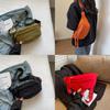 Versatile Water-resistant Canvas Crossbody Bag With Letter Print Perfect For Travel And Casual Use