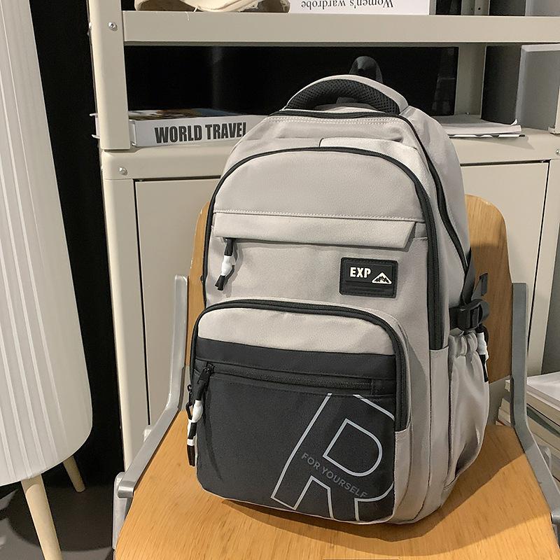High value trendy cool letter backpack couple contrasting colors simple and lightweight travel mountaineering backpack