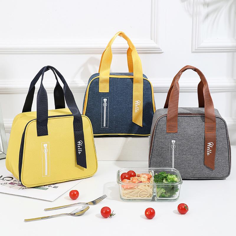 Stylish Oxford Cloth Thermal Lunch Bag - Trapezoidal, Large Capacity, Foldable, Handheld Bento Bag for Students.