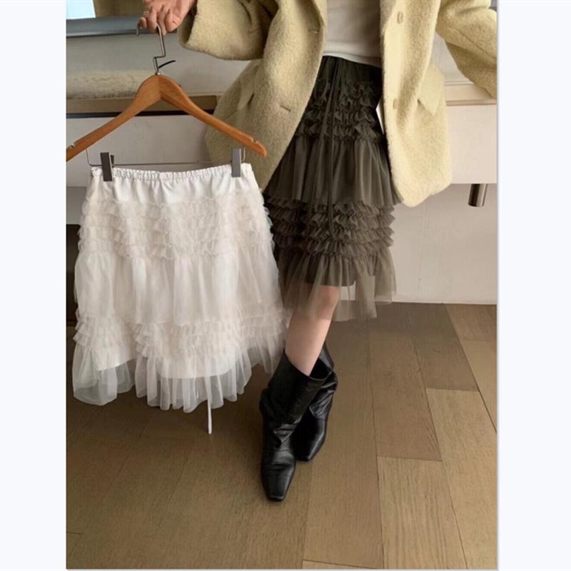 Spring 2026 Essential Korean Style Midi Skirt with Heavy Embroidery, Mesh Layers, and Lace-Up Hem.