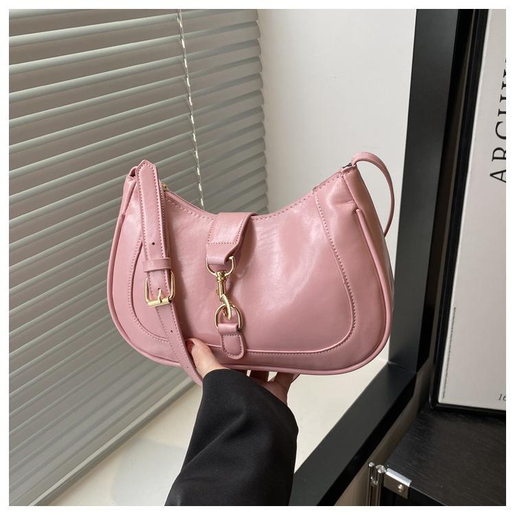 

2025 новая креативная дизайнерская сумка женская модная сумка под мышкой текстура иностранный стиль косая через плечо сумка под мышкой женская сумка кросс розовый