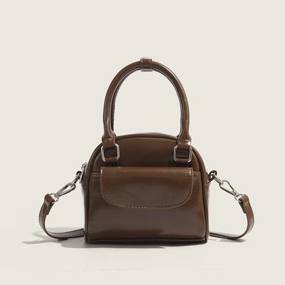 Koreanische Nischendesign Handtasche Neue modische Pendlerhandtasche Retro Mode Umhänge-Muscheltasche Damen