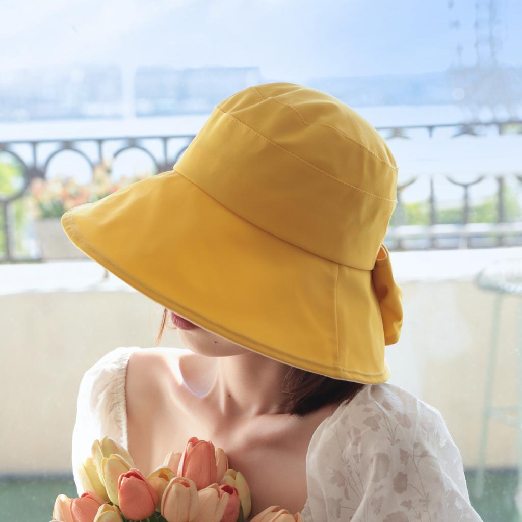 Sunscreen hat women's spring and summer UV protection sunshade bucket hat bow British eaves elegant versatile sun hat