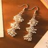 Pair Of Alloy Made Bohemian Style Dangling Earrings With Three Layer Hollow Out Bell Tassels For Versatile Outfits And Special Event