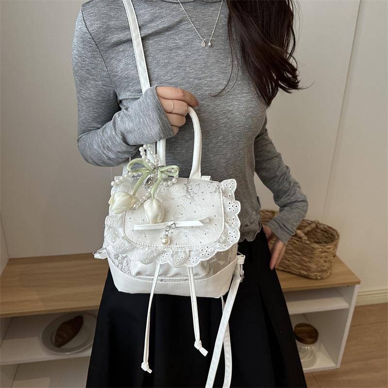 Zaino all'ingrosso stile dolce portatile piccola borsa borsa da donna 1011 estate nuova borsa a tracolla con fiocco in pizzo zaino versatile