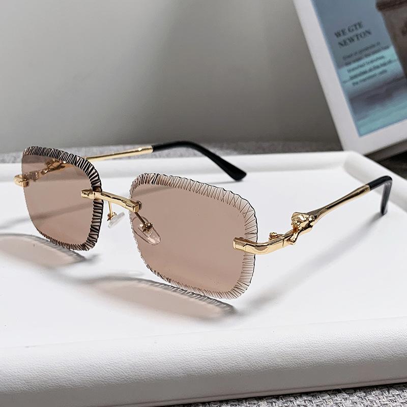 European and American fashion new card home serrated frameless sunglasses European and American ins fashion leopard head metal sunglasses