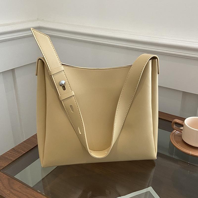 Spring simple style casual solid color wide shoulder strap mother and child bag commuting versatile niche design women's shoulder bag