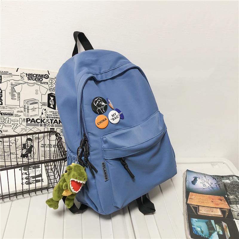 

Backpack Men s Simple Lightweight Large Capacity Versatile Backpack Japanese Junior High School Student School Bag Women Send Badges Single pack синій