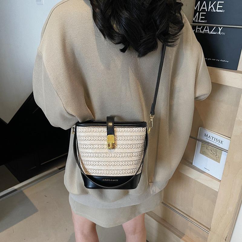 Straw bag women's new summer high-end sense niche fashion portable woven messenger bucket bag