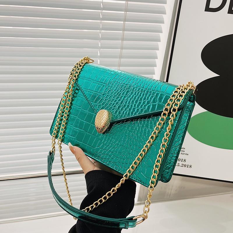 

The new bag 2025 European and American fashion snake pattern retro shoulder bag ins candy color women s chain crossbody чорний