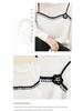Elegant Women's Knit Top with White Lace Collar and Floral Brooch