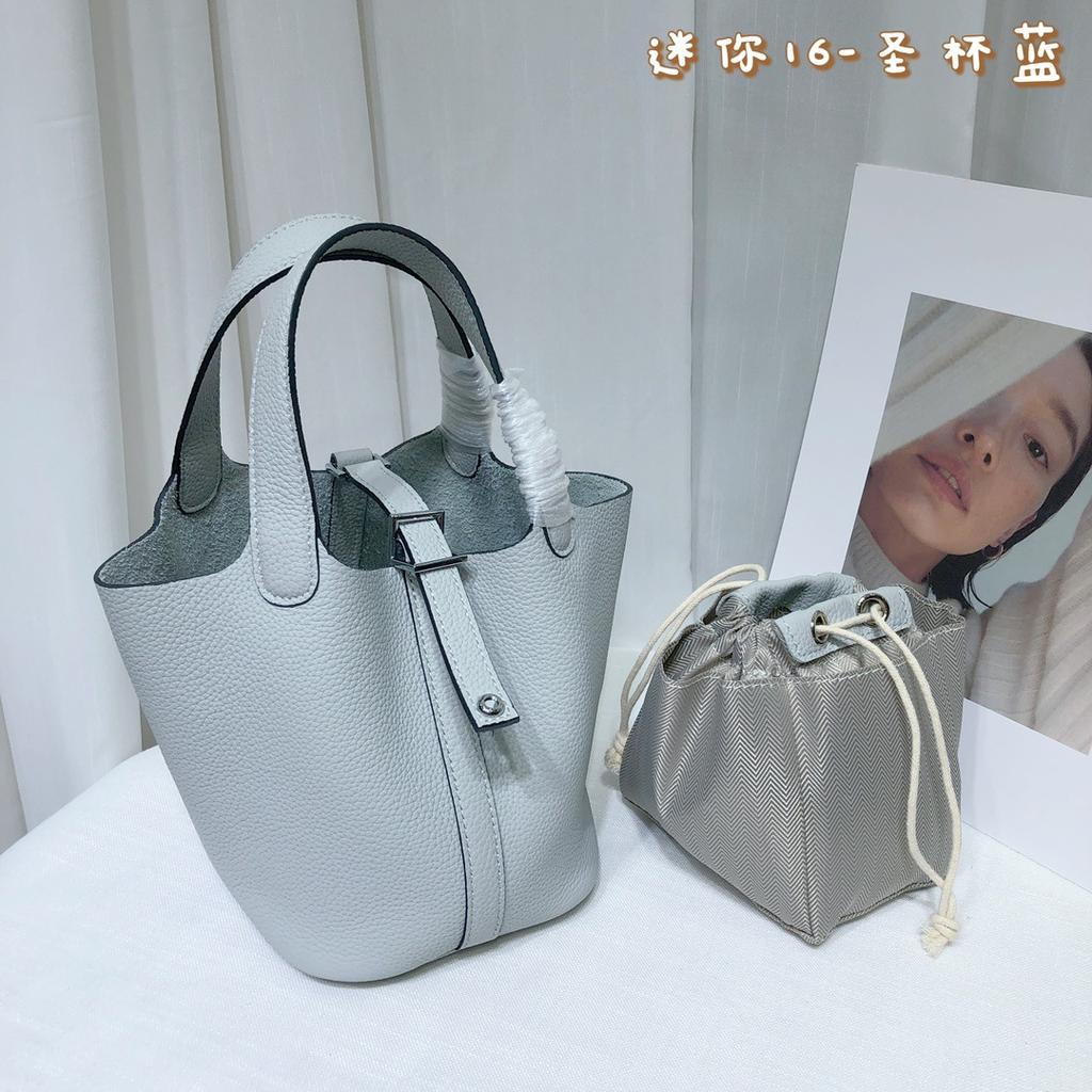 Spot wholesale top layer cowhide vegetable basket bag leather bucket bag commuter fashion lock buckle hand-held handbag woman